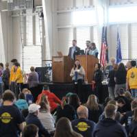 Participants celebrating the medalists in award ceremony
